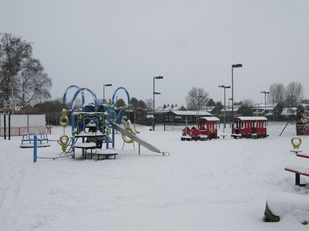 An empty playground with swings