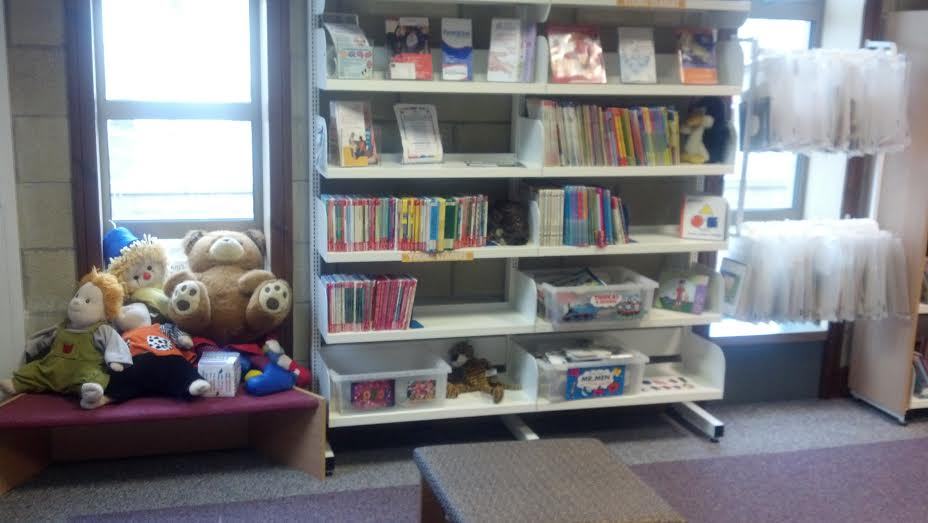 Children's books on a library shelf
